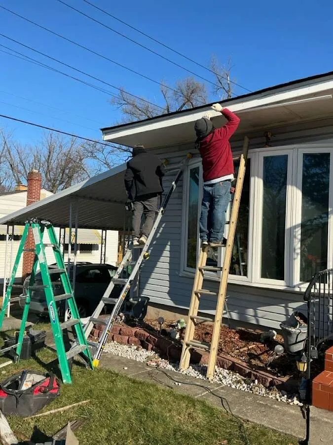 Restoration crew performing exterior repair in Riverdale